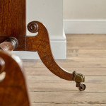 A Regency brown oak sofa table