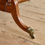 A Regency brown oak sofa table
