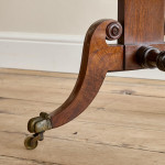 A Regency brown oak sofa table
