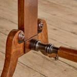 A Regency brown oak sofa table