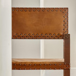 A pair of Arts and Crafts oak and leather armchairs