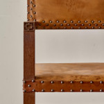 A pair of Arts and Crafts oak and leather armchairs