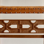 A pair of Arts and Crafts oak and leather armchairs