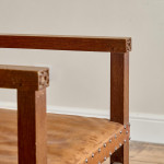 A pair of Arts and Crafts oak and leather armchairs