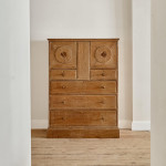 An Arts & Crafts limed oak cabinet by Ambrose Heal for Heal's