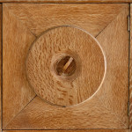 An Arts & Crafts limed oak cabinet by Ambrose Heal for Heal's