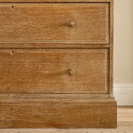 An Arts & Crafts limed oak cabinet by Ambrose Heal for Heal's