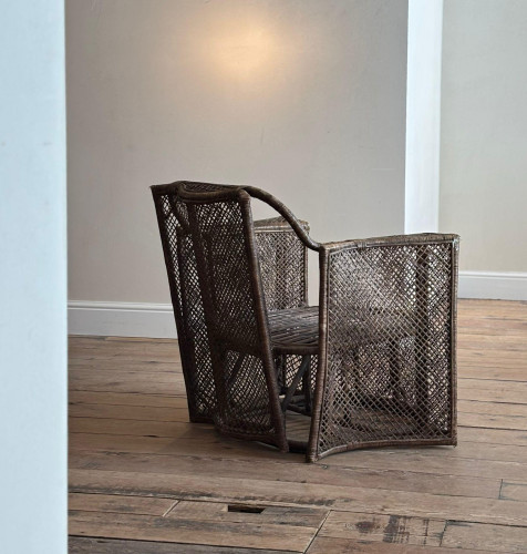 A large woven wicker armchair