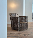 A large woven wicker armchair
