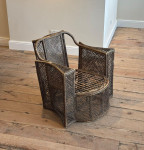 A large woven wicker armchair
