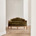 A small Art Deco giltwood settee in the manner of Poul Follot