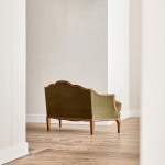 A small Art Deco giltwood settee in the manner of Poul Follot