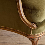 A small Art Deco giltwood settee in the manner of Poul Follot