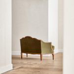A small Art Deco giltwood settee in the manner of Poul Follot (1877 - 1941)