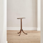 A narrow Regency penwork tripod table