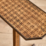 A narrow Regency penwork tripod table