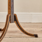 A narrow Regency penwork tripod table