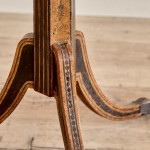 A narrow Regency penwork tripod table