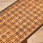 A narrow Regency penwork tripod table