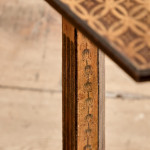 A narrow Regency penwork tripod table