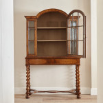 An unusual William & Mary style burr oak and seaweed marquetry glazed cabinet on stand