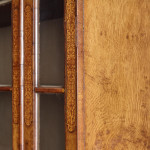 An unusual William & Mary style burr oak and seaweed marquetry glazed cabinet on stand