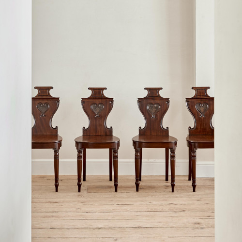 A set of four Regency mahogany hall chairs