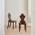 A set of four Regency mahogany hall chairs