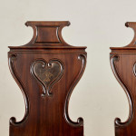 A set of four Regency mahogany hall chairs