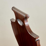 A set of four Regency mahogany hall chairs
