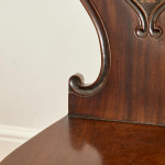 A set of four Regency mahogany hall chairs