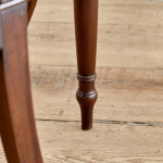 A set of four Regency mahogany hall chairs