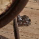A large Regency faux rosewood curule stool in the manner of George Smith (1786 - 1828)