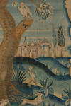A large Flemish wool and silk blue verdure armorial  tapestry