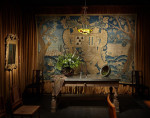 A large Flemish wool and silk blue verdure armorial  tapestry
