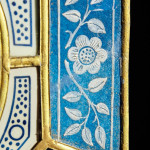 A rare Aesthetic movement octagonal enamelled glass mirror by James Powell & Sons