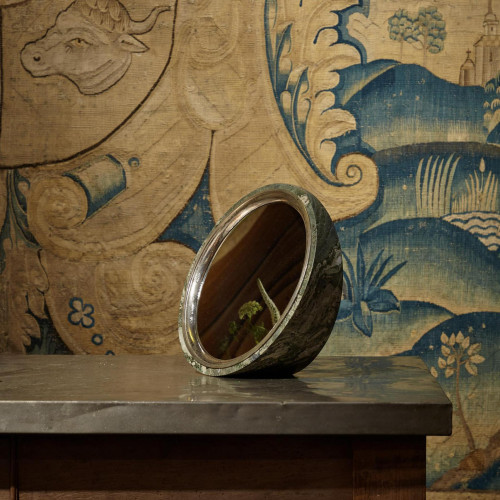 A Swedish Green marble and sterling silver elliptical mirror by Alex Foster (b. 1990)