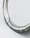 A Swedish Green marble and sterling silver elliptical mirror by Alex Foster (b. 1990)