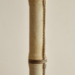 A saddle stitched suede floor lamp by Jacques Adnet (1900 - 1984)