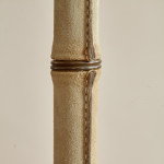 A saddle stitched suede floor lamp by Jacques Adnet (1900 - 1984)