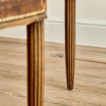 A pair of Art Deco beech and leather upholstered side chairs in the manner of Poul Follot (1877 - 1941)