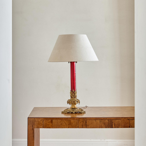 A large ruby glass and gilt brass table lamp