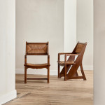 A pair of Arts & Crafts oak and rush elbow chairs
