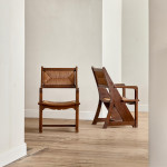 A pair of Arts & Crafts oak and rush elbow chairs