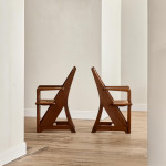A pair of Arts & Crafts oak and rush elbow chairs