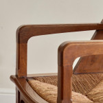A pair of Arts & Crafts oak and rush elbow chairs