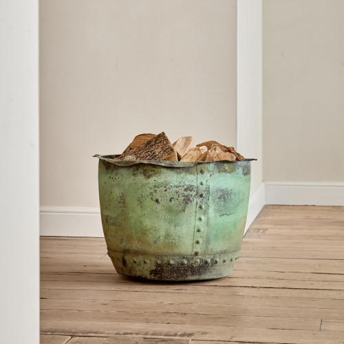 A large riveted verdigris copper