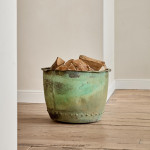 A large riveted verdigris copper