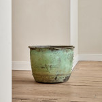 A large riveted verdigris copper