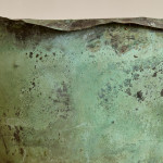 A large riveted verdigris copper